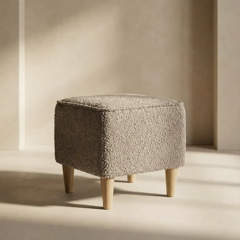 Upholstered pouf and footstool by EWAcompany